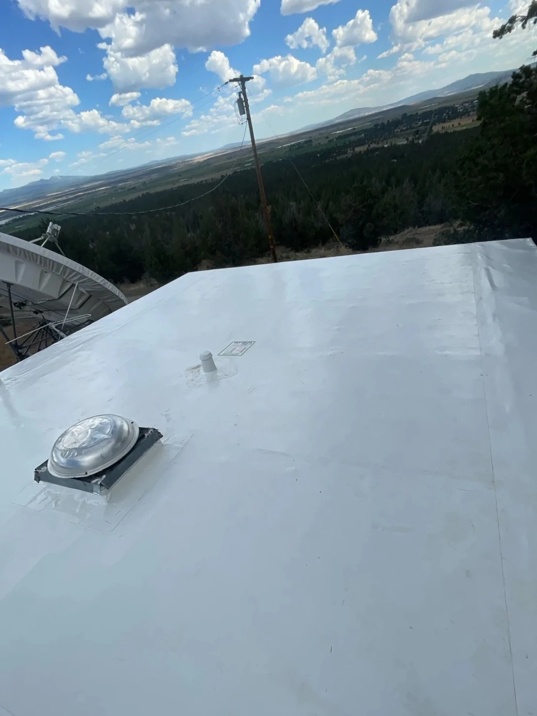 After photo of a completed Alturas low-slope roof project by Linkville Roofing and Siding