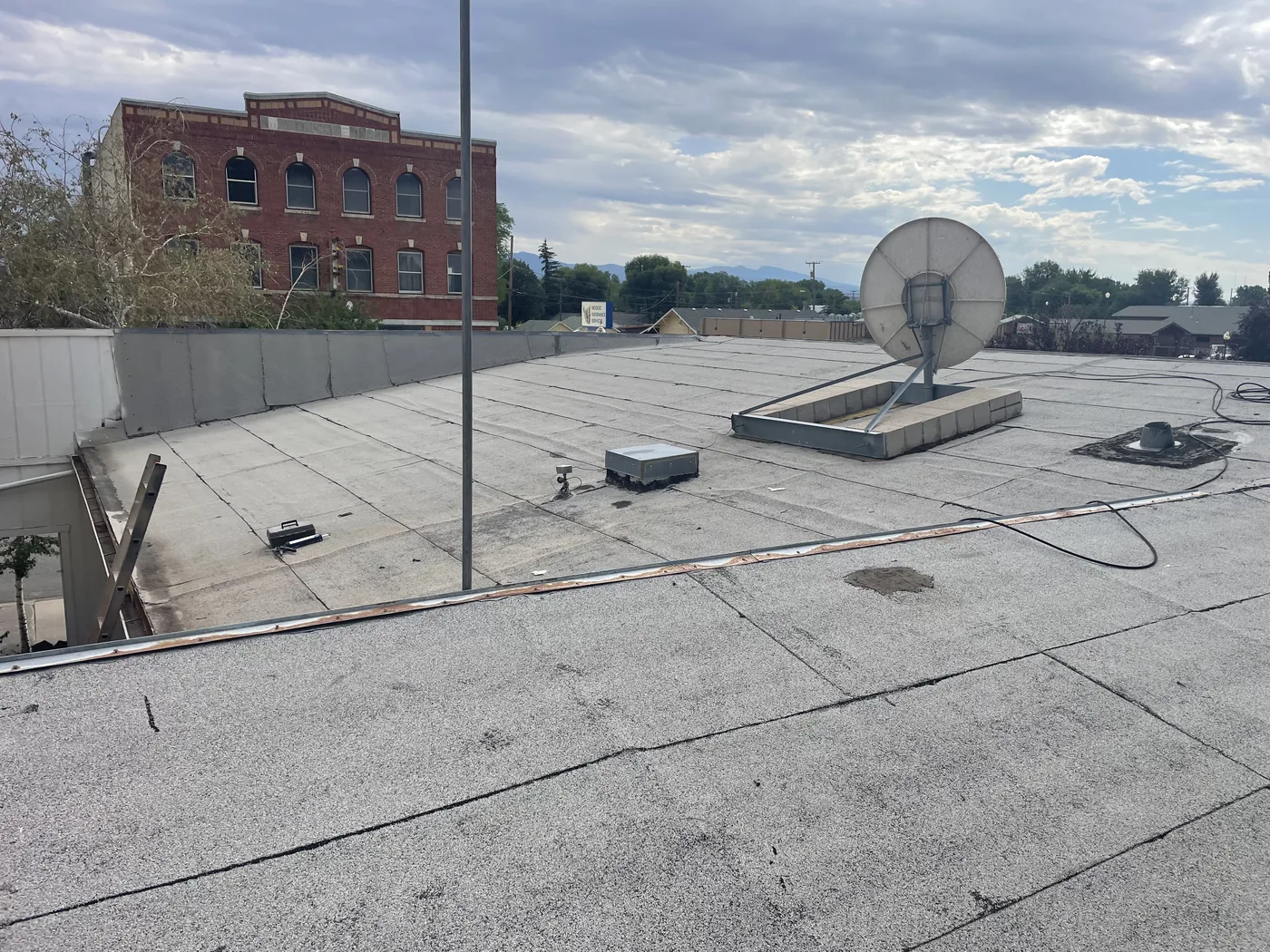 Before photo of an Alturas low-slope commercial roof project by Linkville Roofing and Siding