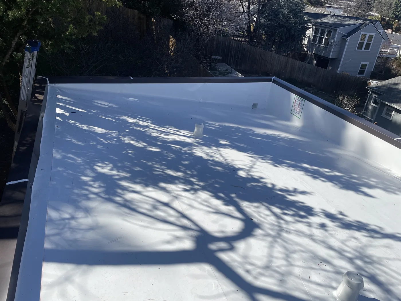 After photo of a completed Ashland low-slope roof project by Linkville Roofing and Siding