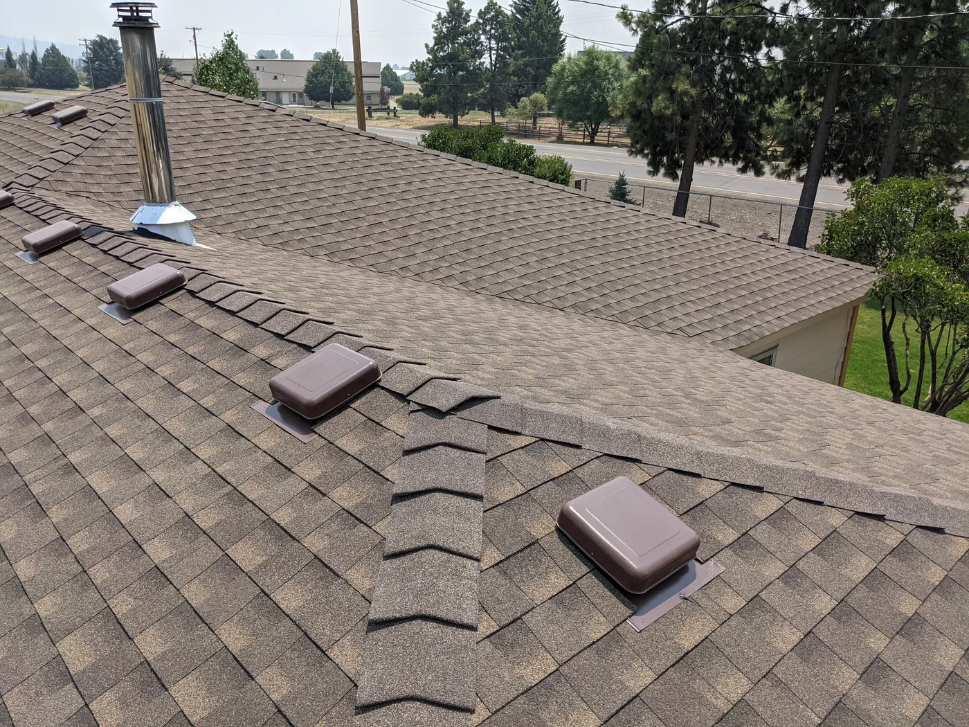 After photo of a Lakeview shingle and low-slope roof project by Linkville Roofing and Siding
