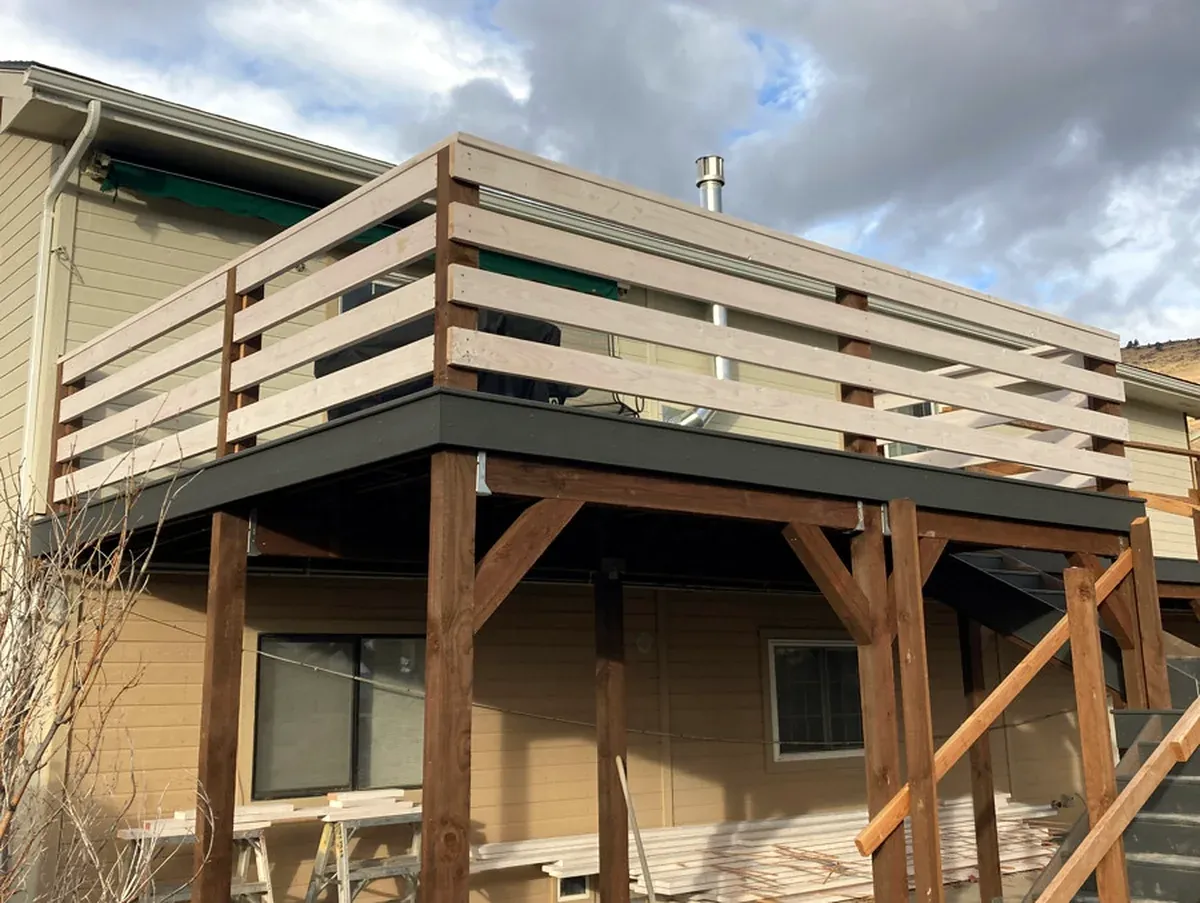 Finished exterior project showing new deck construction work