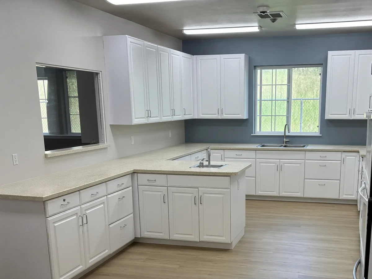 Kitchen after interior painting with clean walls and cabinets
