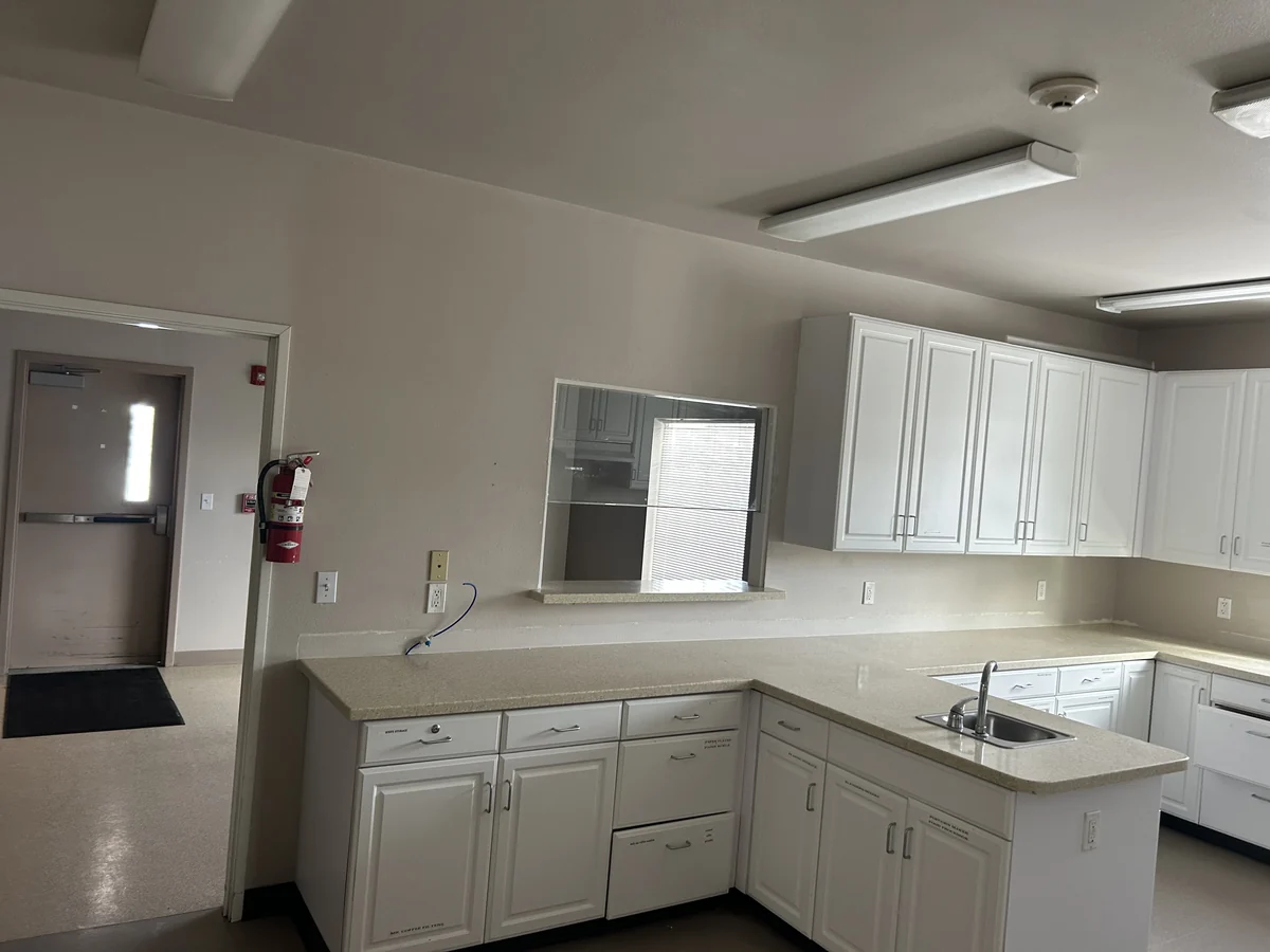 Kitchen before interior painting by Linkville Roofing and Siding
