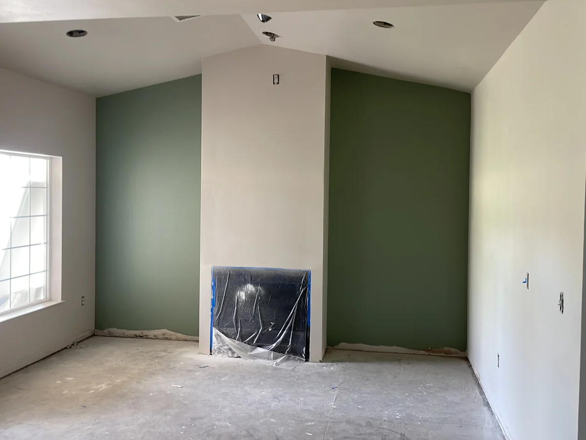 Living room after green accent wall interior painting