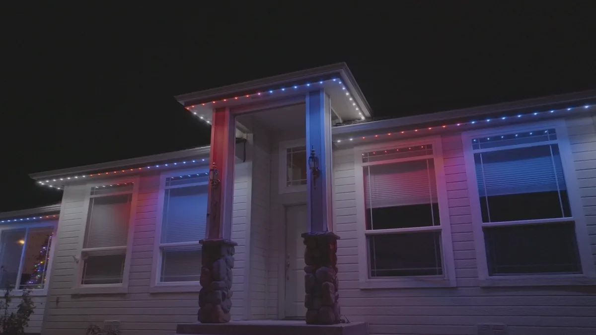 Night view of permanent outdoor lighting around a home entry