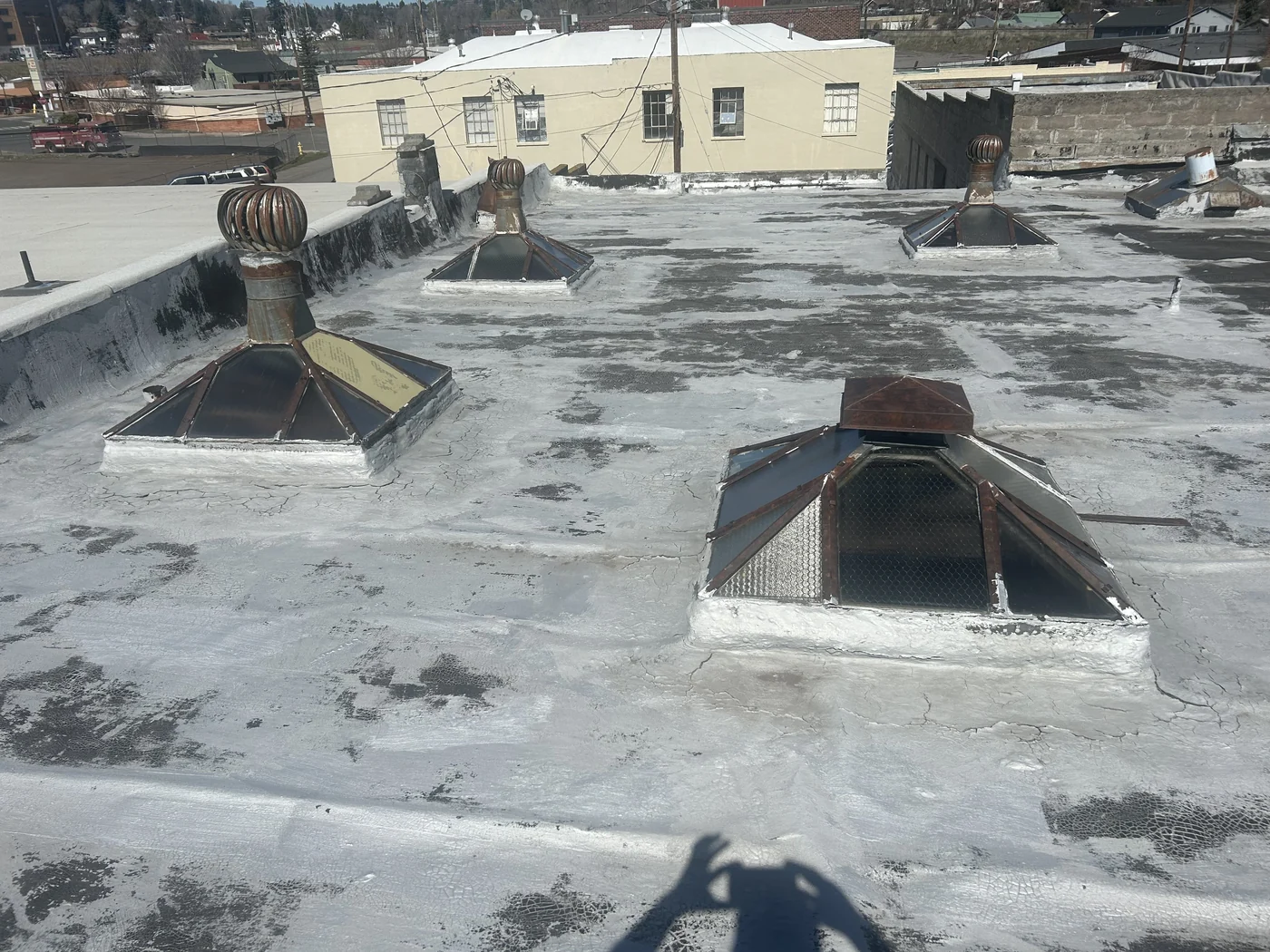 Before photo of commercial flat roof before roofing work by Linkville Roofing and Siding