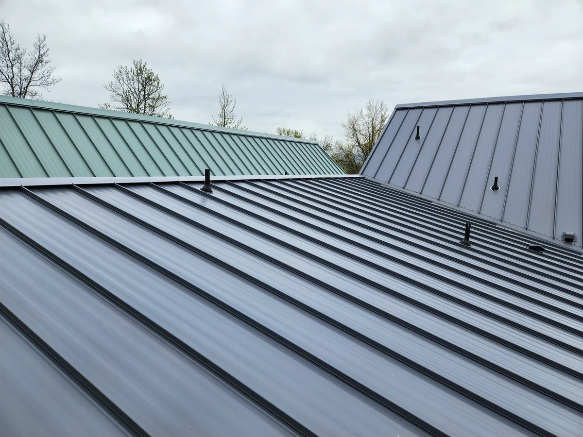 Detailed view of standing seam metal roofing by Linkville Roofing and Siding